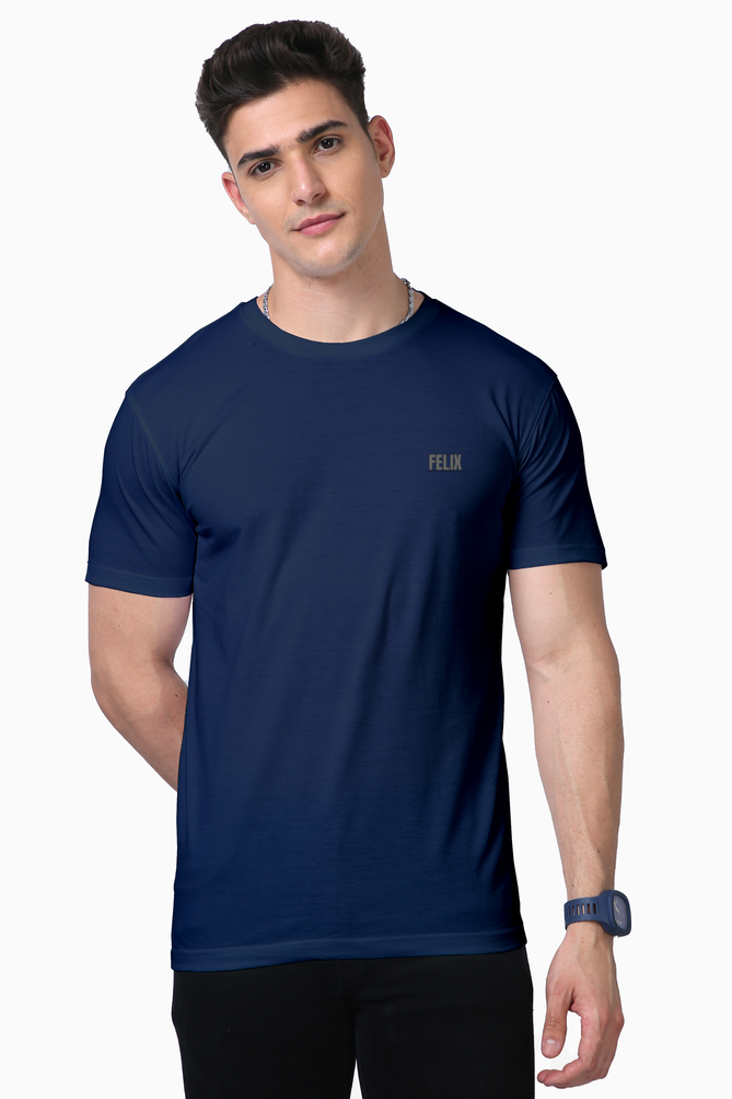 Male model in FELIX black Supima cotton t-shirt with grey reflective vinyl logo on chest – minimalist premium gym and streetwear fashion India