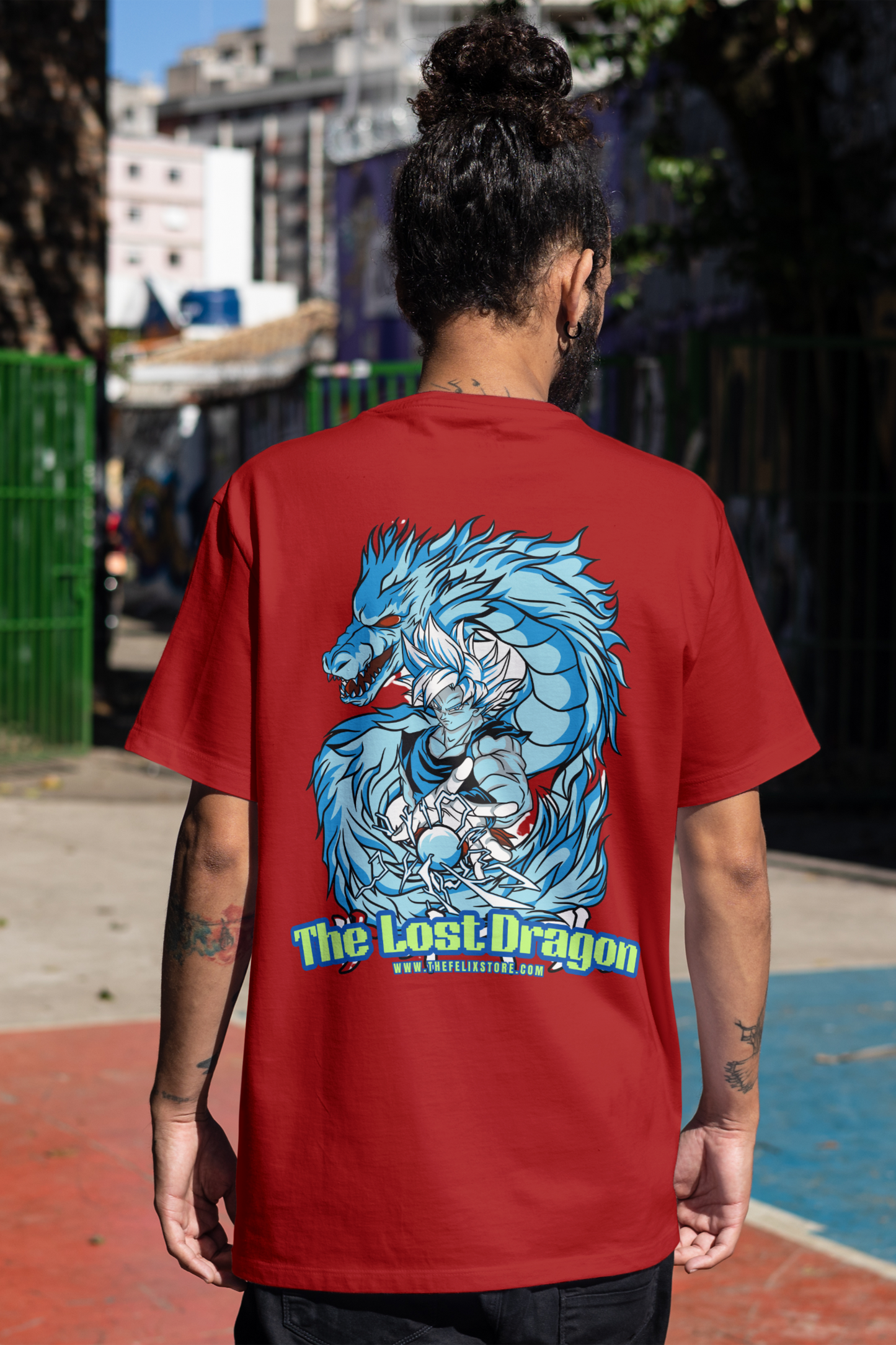 Person wearing a red t-shirt with a blue dragon graphic and 'The Lost Dragon' text.