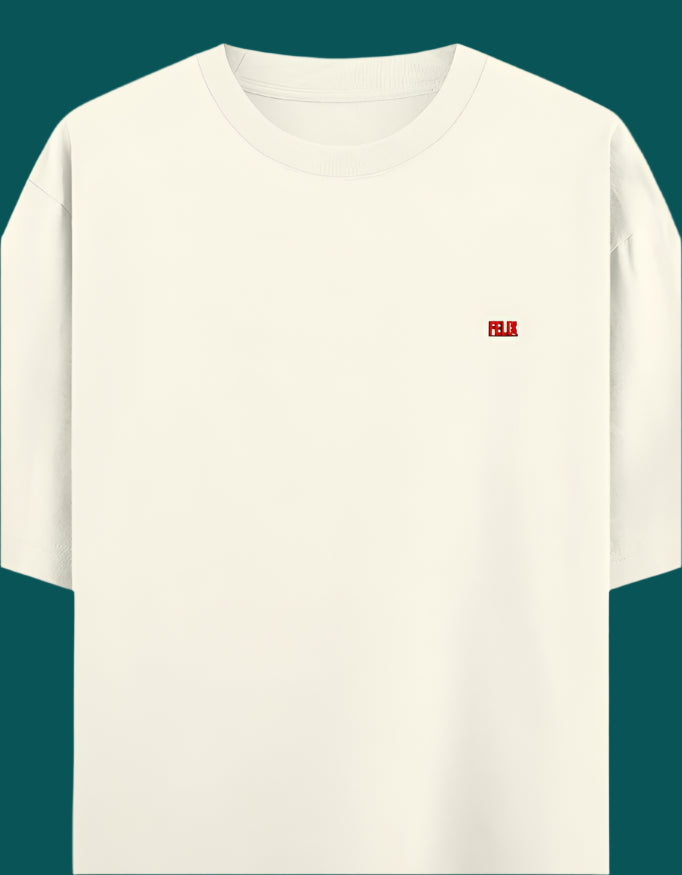Beige t-shirt with a small red logo on a light gray background