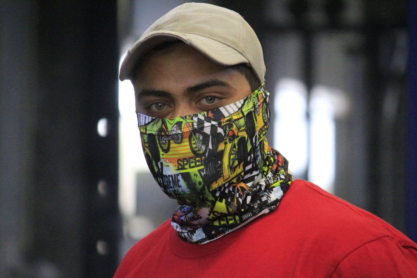 "Man wearing a colorful neck gaiter perfect for summer protection and outdoor use"