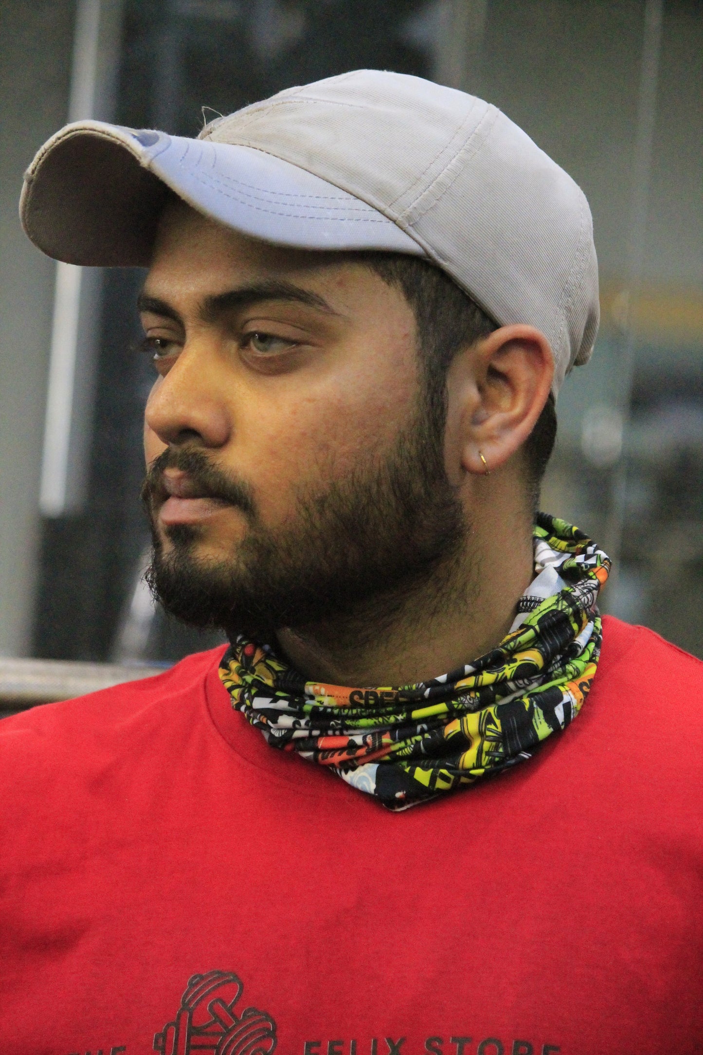"Man wearing a colorful neck gaiter perfect for summer protection and outdoor use"