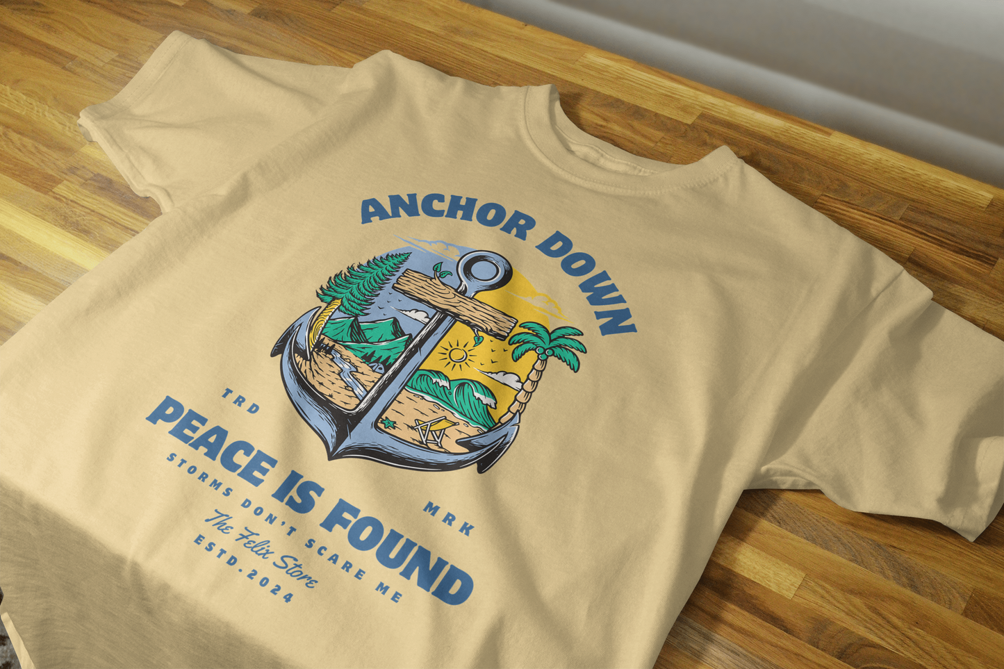 "Anchor Down Peace is Found graphic t-shirt by The Felix Store featuring anchor, palm trees, mountains, and sunshine in artistic beach-forest design"