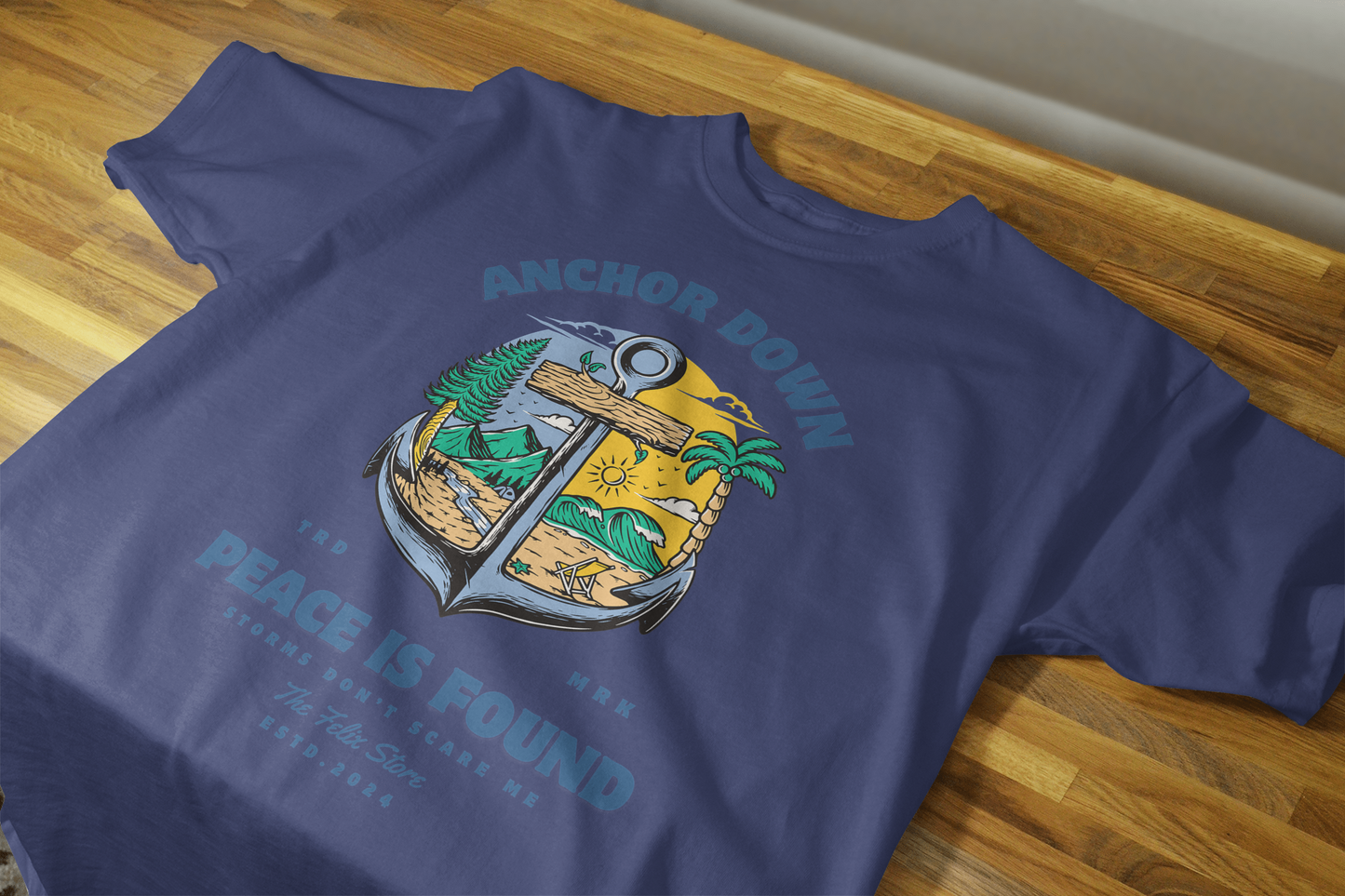 "Anchor Down Peace is Found graphic t-shirt by The Felix Store featuring anchor, palm trees, mountains, and sunshine in artistic beach-forest design"