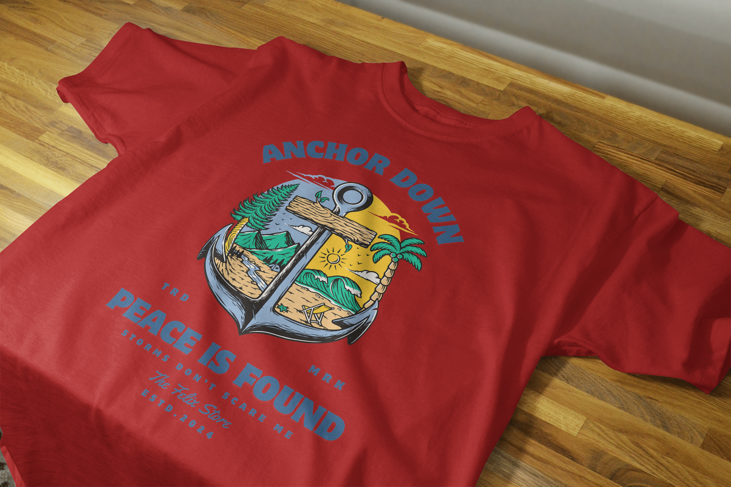 "Anchor Down Peace is Found graphic t-shirt by The Felix Store featuring anchor, palm trees, mountains, and sunshine in artistic beach-forest design"