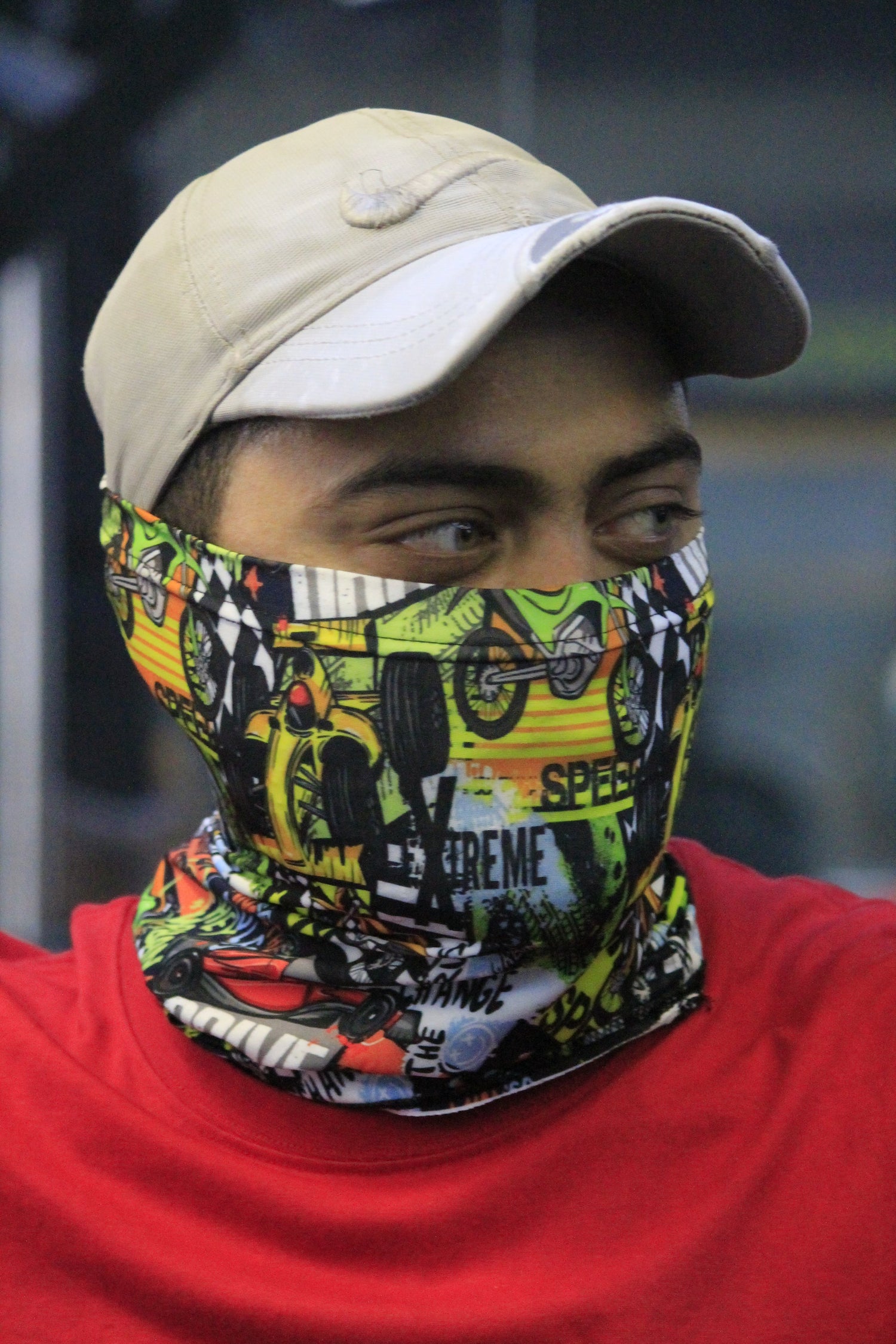 "Man wearing a colorful neck gaiter perfect for summer protection and outdoor use"